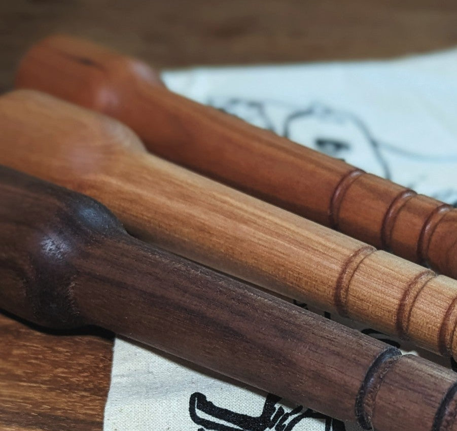 Three wooden cocktail muddlers